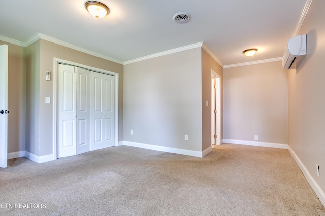 unfurnished bedroom featuring visible vents, a wall unit AC, ornamental molding, and carpet