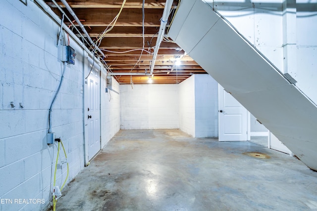 unfinished below grade area with concrete block wall