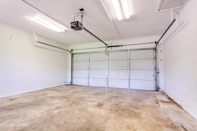 garage featuring a garage door opener
