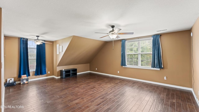 bonus room featuring baseboards, ceiling fan, and visible vents