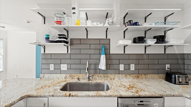 kitchen featuring a sink, tasteful backsplash, open shelves, and dishwasher