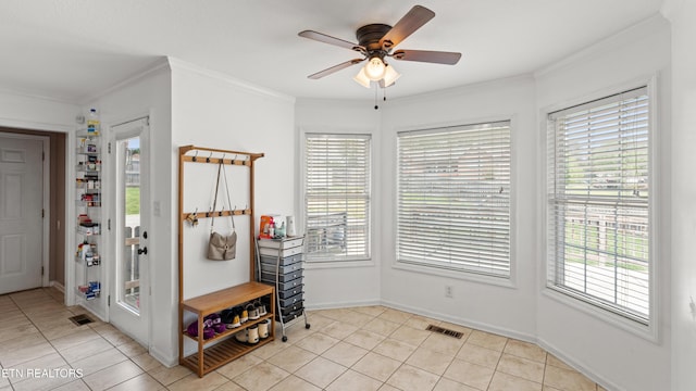 foyer with light tile patterned floors, visible vents, and a wealth of natural light