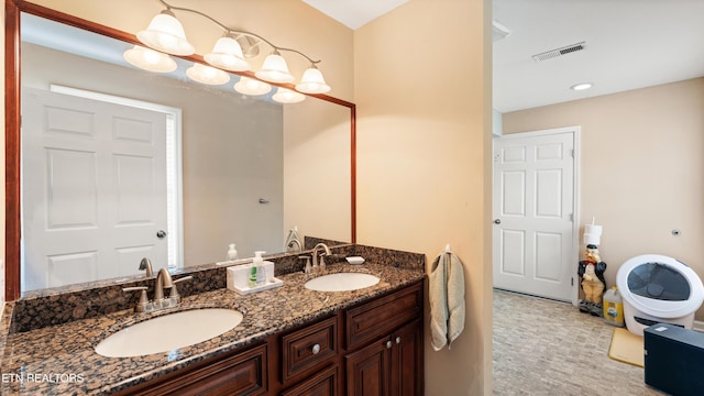 bathroom featuring a sink, recessed lighting, double vanity, and visible vents