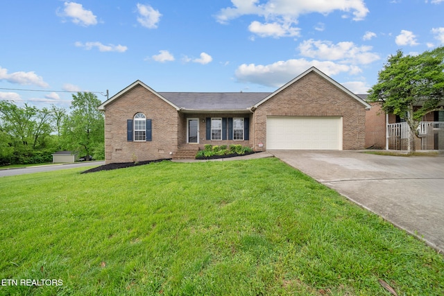 4762 Cabbage Ln, Knoxville, TN 37938 - single story home with a garage, brick siding, a front yard, and driveway