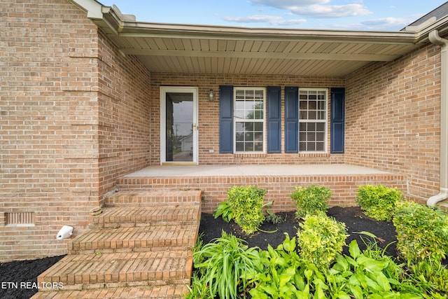 4762 Cabbage Ln, Knoxville, TN 37938 - doorway to property with covered porch and brick siding