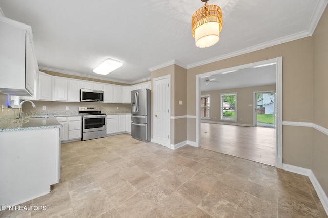 4762 Cabbage Ln, Knoxville, TN 37938 - kitchen with white cabinets, a sink, appliances with stainless steel finishes, baseboards, and ornamental molding
