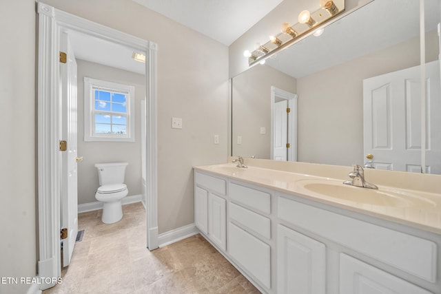 4762 Cabbage Ln, Knoxville, TN 37938 - full bathroom with baseboards, toilet, double vanity, and a sink