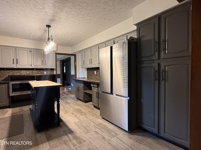 391 Underwood Grove Rd, Cumberland Gap, TN 37724 - kitchen featuring freestanding refrigerator, decorative backsplash, wood counters, decorative light fixtures, and wall oven