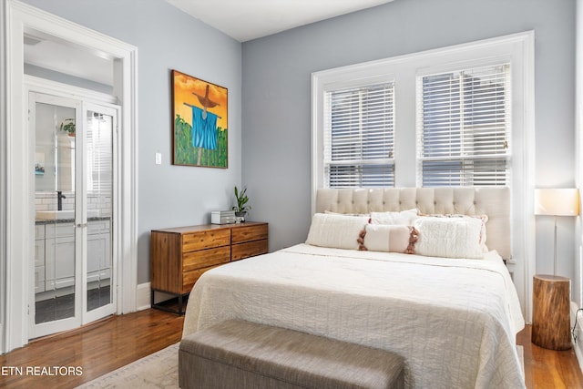 bedroom featuring wood finished floors