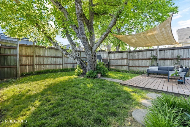 view of yard with a deck and a fenced backyard