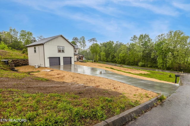 exterior space with concrete driveway