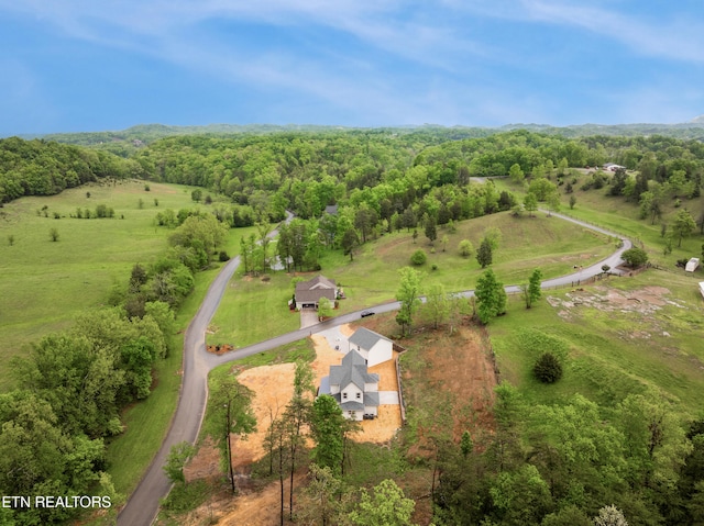 drone / aerial view with a rural view and a view of trees