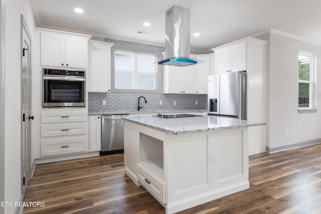 kitchen featuring dark wood-style floors, island range hood, stainless steel appliances, and decorative backsplash