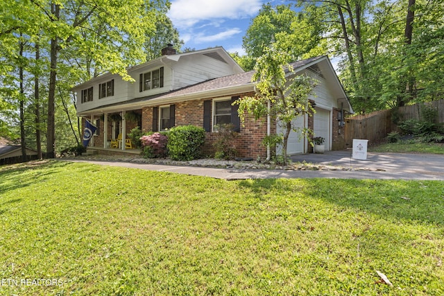 705 Kimbee Rd, Knoxville, TN 37923 - traditional-style house with fence, an attached garage, brick siding, a chimney, and concrete driveway
