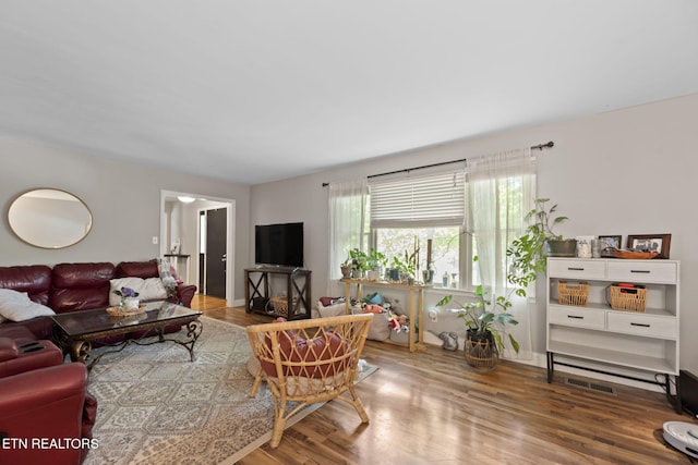 705 Kimbee Rd, Knoxville, TN 37923 - living area with visible vents, baseboards, and wood finished floors