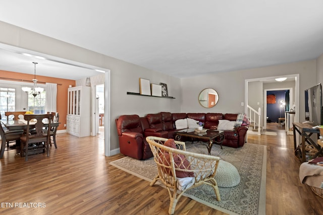 705 Kimbee Rd, Knoxville, TN 37923 - living area with baseboards, an inviting chandelier, and wood finished floors
