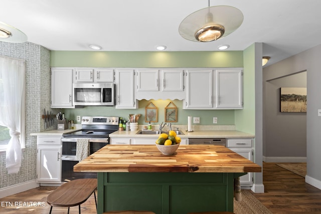 705 Kimbee Rd, Knoxville, TN 37923 - kitchen featuring butcher block countertops, a sink, appliances with stainless steel finishes, and white cabinets