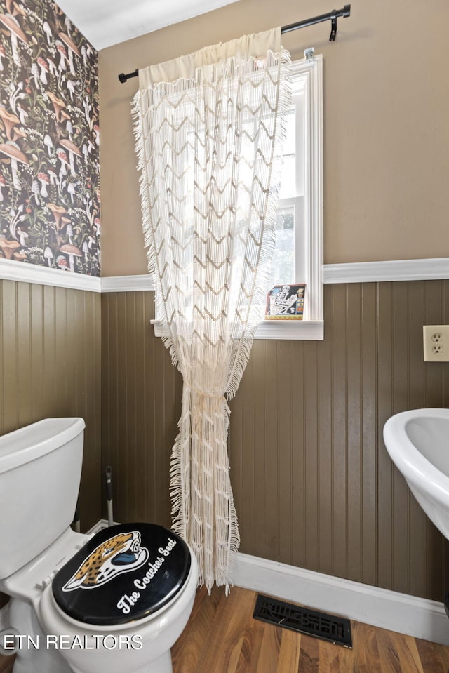 705 Kimbee Rd, Knoxville, TN 37923 - half bathroom with a wainscoted wall, toilet, wood finished floors, and visible vents