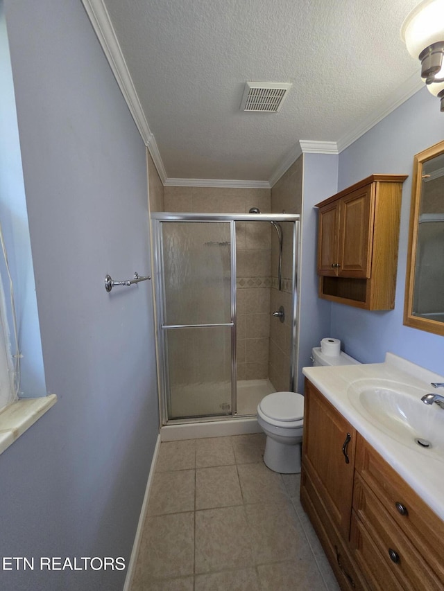 full bath featuring visible vents, vanity, toilet, a textured ceiling, and a shower stall
