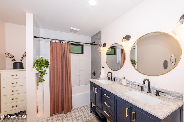 full bathroom with double vanity, tile patterned floors, and shower / bath combo with shower curtain