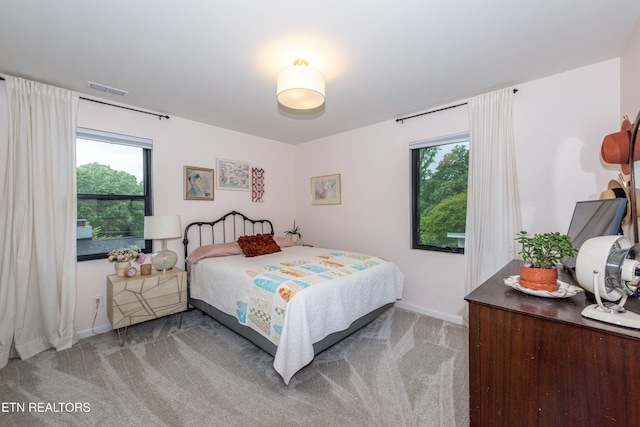 bedroom with carpet and baseboards