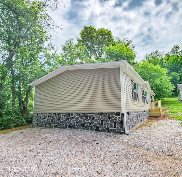 view of side of property featuring crawl space