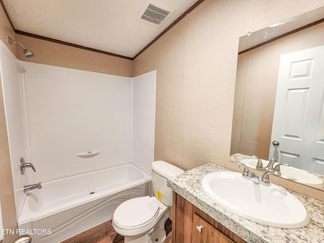 full bath with vanity, toilet, visible vents, tub / shower combination, and wood finished floors