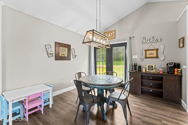dining area with an inviting chandelier, baseboards, vaulted ceiling, and dark wood finished floors