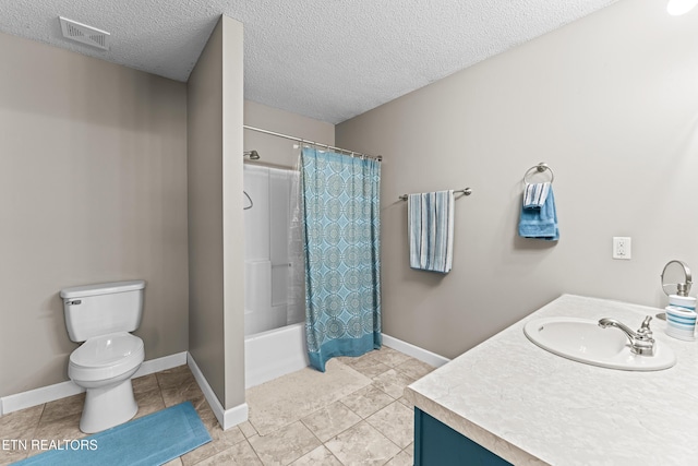 bathroom featuring toilet, tile patterned flooring, visible vents, and a textured ceiling
