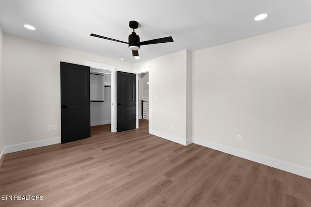 922 Eagle Point Dr, Loudon, TN 37774 - unfurnished bedroom with a ceiling fan, a closet, recessed lighting, baseboards, and light wood-type flooring