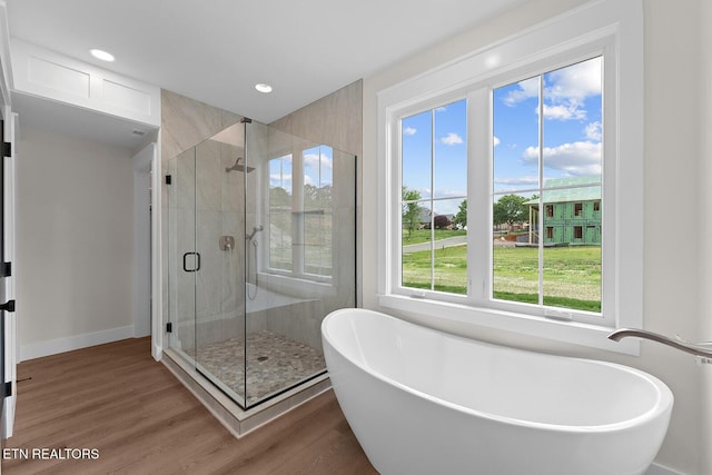 922 Eagle Point Dr, Loudon, TN 37774 - full bathroom with a shower stall, recessed lighting, a freestanding bath, and wood finished floors