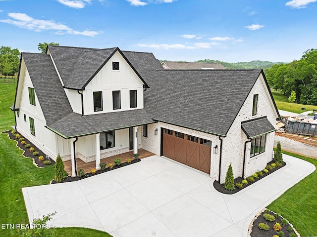 922 Eagle Point Dr, Loudon, TN 37774 - modern inspired farmhouse featuring a porch, roof with shingles, board and batten siding, and driveway
