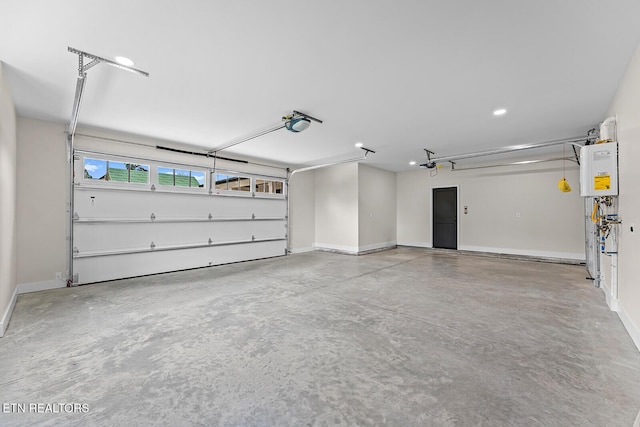 922 Eagle Point Dr, Loudon, TN 37774 - garage with recessed lighting, baseboards, and a garage door opener