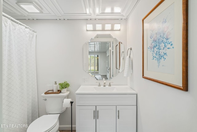 bathroom with toilet and vanity