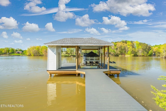 view of dock with a water view and boat lift