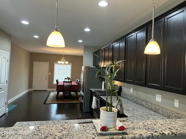 1631 Silver Spur Ln, Knoxville, TN 37932 - kitchen with a chandelier, light stone countertops, dark wood finished floors, and recessed lighting
