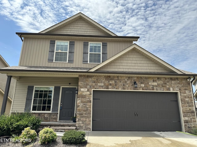 1631 Silver Spur Ln, Knoxville, TN 37932 - craftsman-style home featuring a garage, board and batten siding, driveway, and stone siding