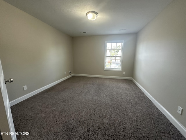 1631 Silver Spur Ln, Knoxville, TN 37932 - unfurnished room with dark colored carpet and baseboards