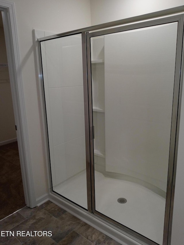 bathroom with a stall shower