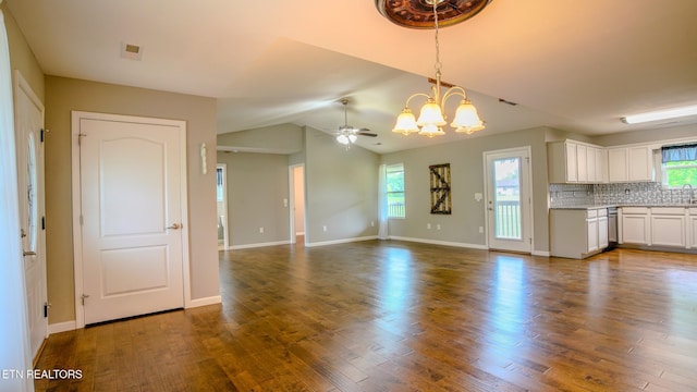 645 Bryce View Ln, Sevierville, TN 37876 - unfurnished living room with baseboards, dark wood-style flooring, and a wealth of natural light