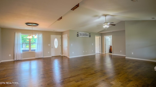 645 Bryce View Ln, Sevierville, TN 37876 - unfurnished living room featuring vaulted ceiling, baseboards, ceiling fan with notable chandelier, and dark wood finished floors