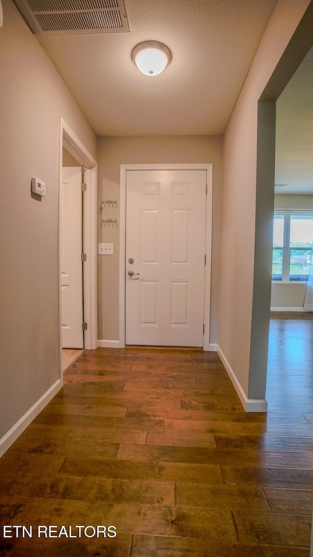645 Bryce View Ln, Sevierville, TN 37876 - corridor featuring baseboards, wood finished floors, and visible vents