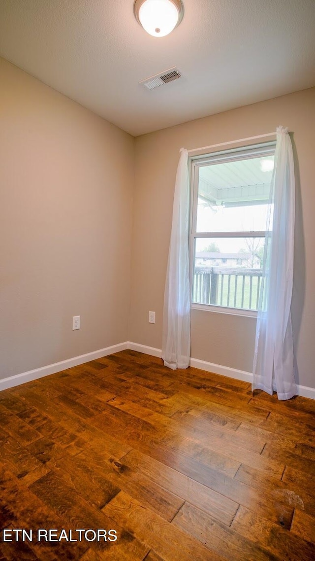 645 Bryce View Ln, Sevierville, TN 37876 - empty room with visible vents, wood-type flooring, and baseboards