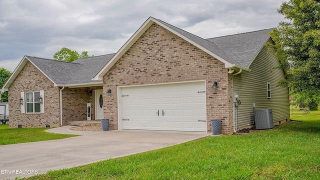 645 Bryce View Ln, Sevierville, TN 37876 - view of front facade with an attached garage, roof with shingles, and cooling unit