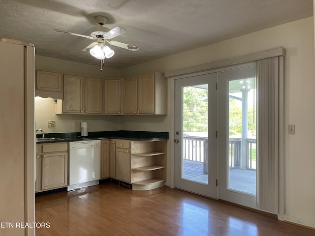 kitchen with open shelves, white appliances, dark countertops, and dark wood-type flooring