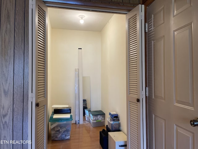 hallway with wood finished floors