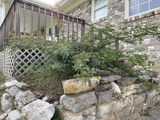 view of property exterior with brick siding