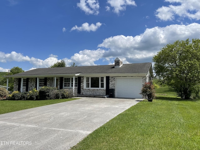 ranch-style house featuring an attached garage, concrete driveway, brick siding, and a front lawn