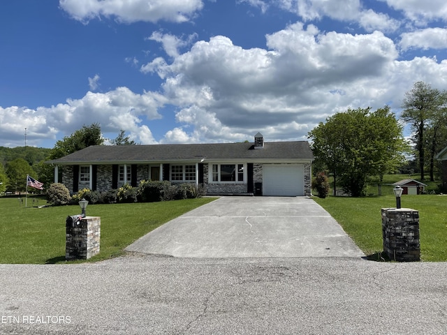ranch-style home with concrete driveway, a garage, a front lawn, and stone siding
