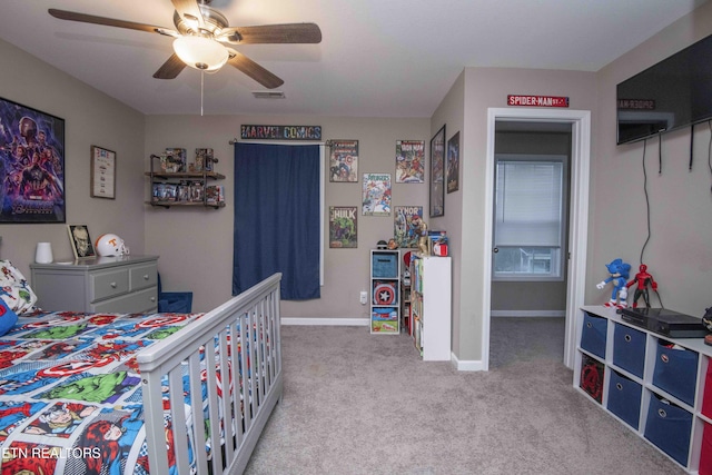 bedroom with carpet flooring, baseboards, and a ceiling fan